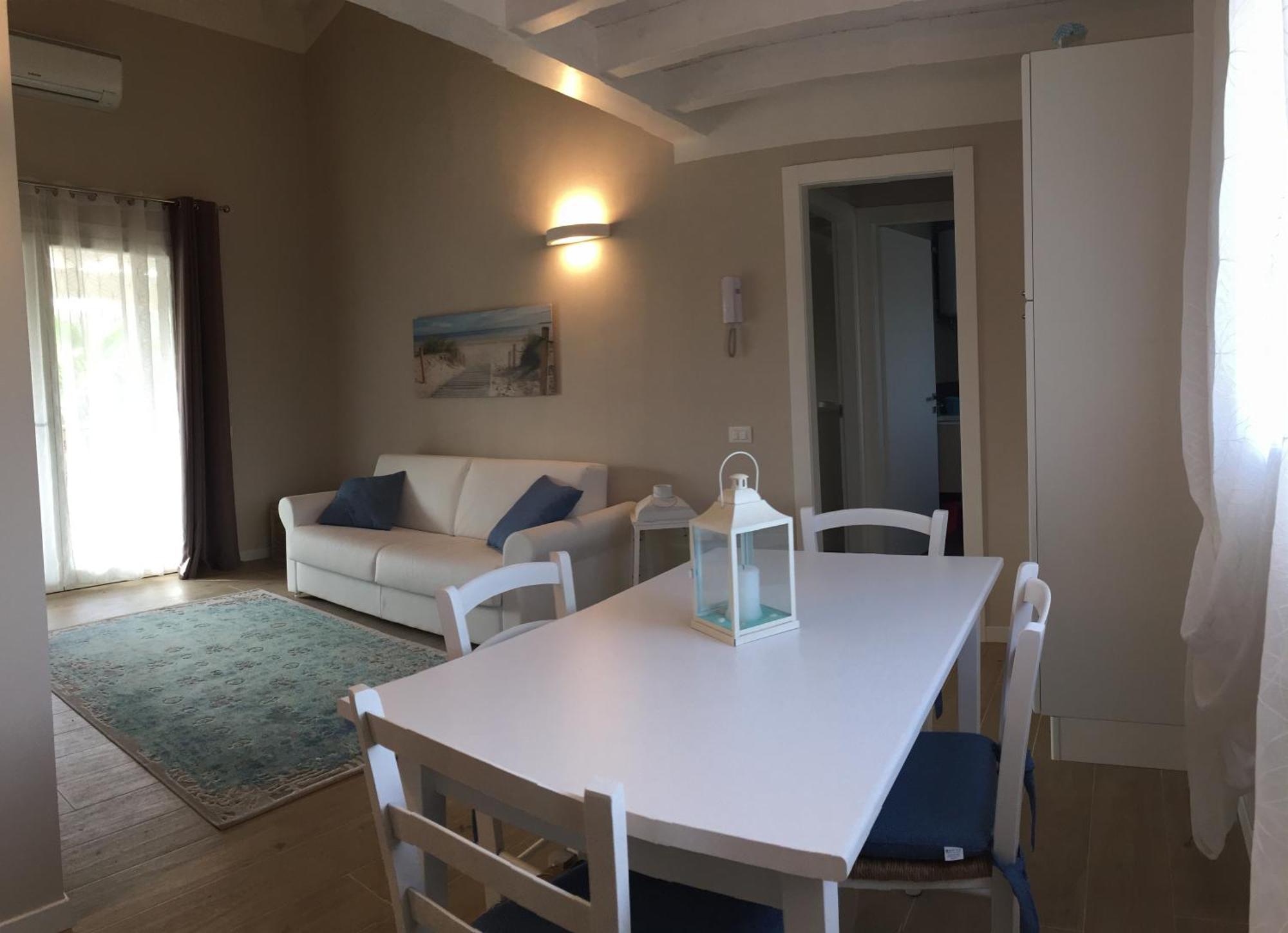 Residence Elegance Ville Ed Appartamenti A Porto Pino Bagian luar foto